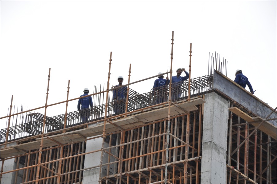 builders on part of a building near the royal palace