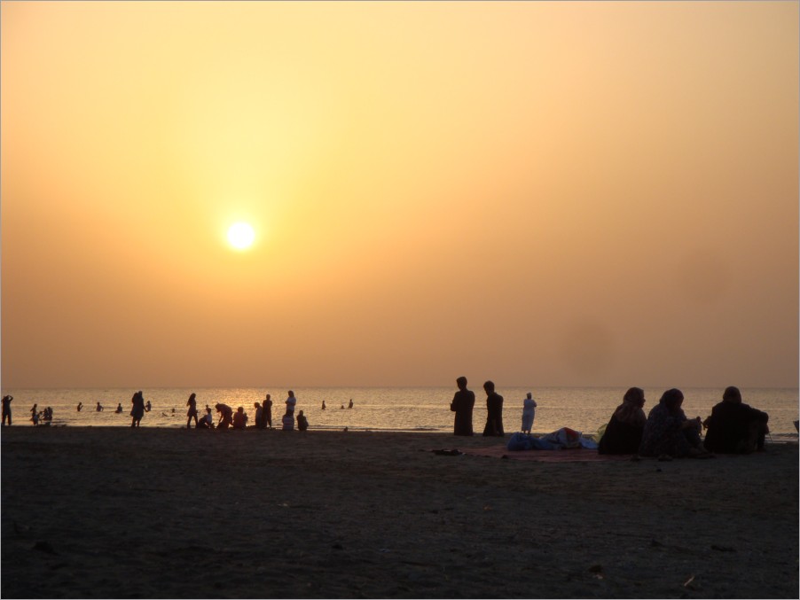 watching the sunset with all the locals on the beach.