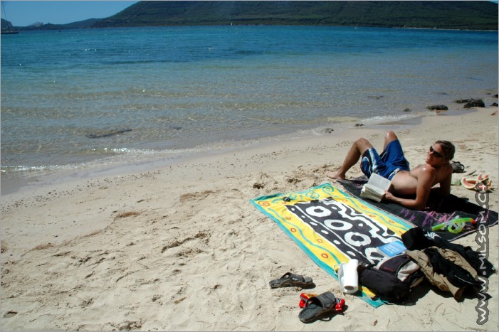 reading and relaxing at the beach